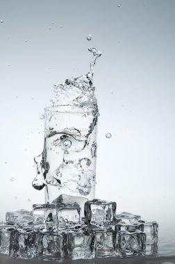 Water drink splashing out from glass clipart