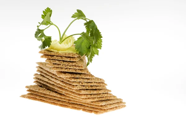 Diet crackers with parsley and butter. — Stock Photo, Image
