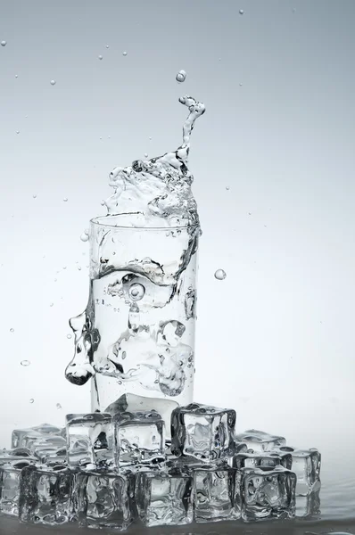 Water drink splashing out from glass — Stock Photo, Image