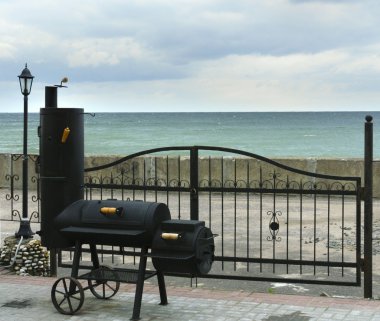 Smoking shed on sea coast clipart