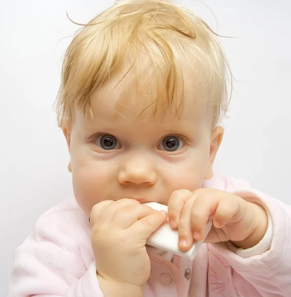 Baby mangiare telecomando — Foto Stock