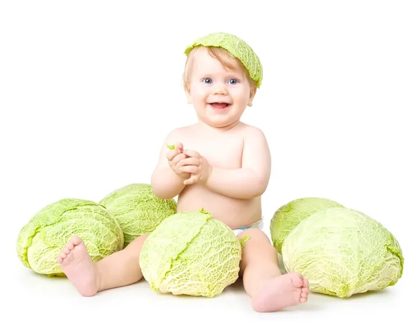 Criança pequena e um repolho de sabóia — Fotografia de Stock
