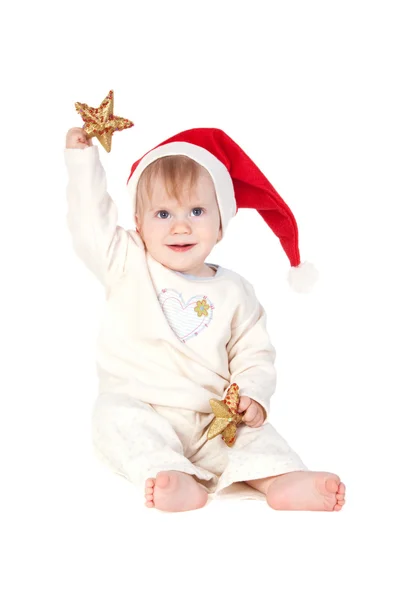 Noel Baba şapkalı gülümseyen bebek kız — Stok fotoğraf