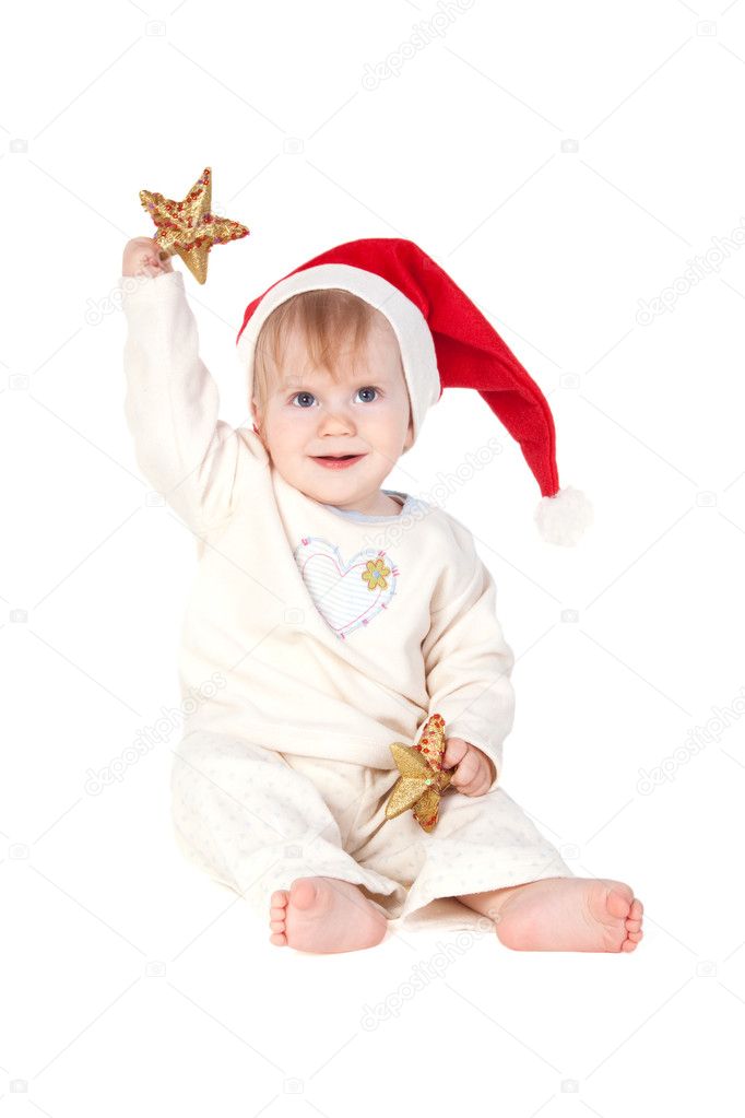 Smiling baby girl in Santa hat