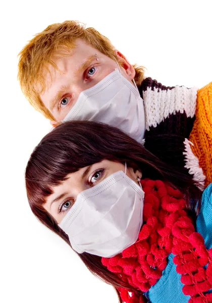 Stock image Young couple in medical masks