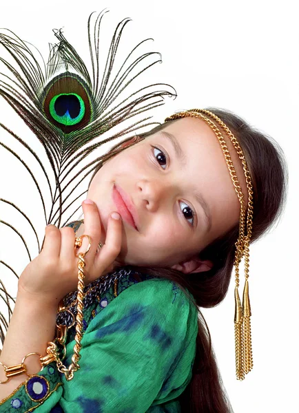 Girl with the feather of peacock — Stock Photo, Image