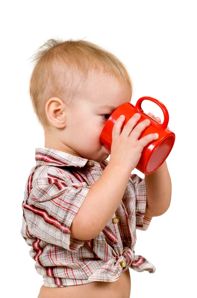 Kind mit einer Tasse Stockbild