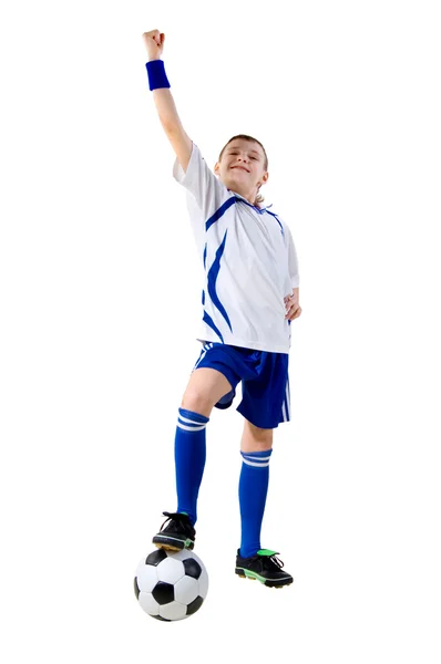 Αγόρι ένα ποδοσφαιριστής ξυλοδαρμό σε μια σφαίρα Royalty Free Εικόνες Αρχείου
