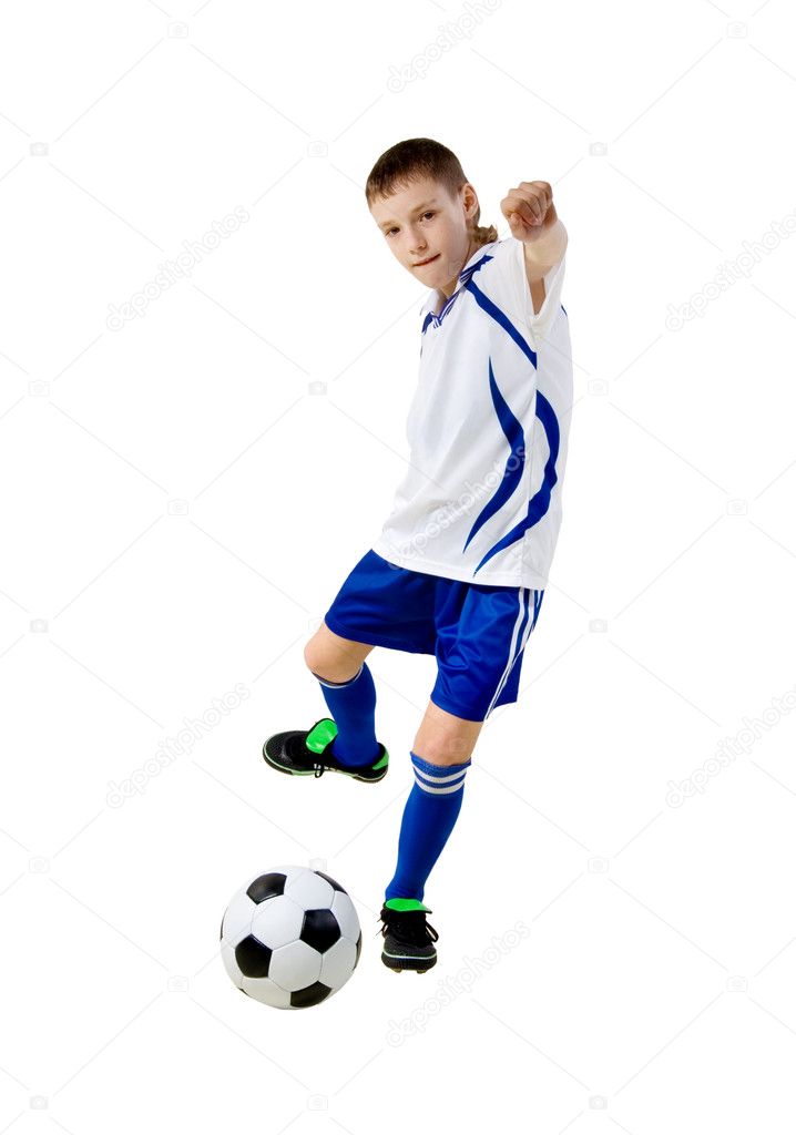 Boy a footballer beating on a ball