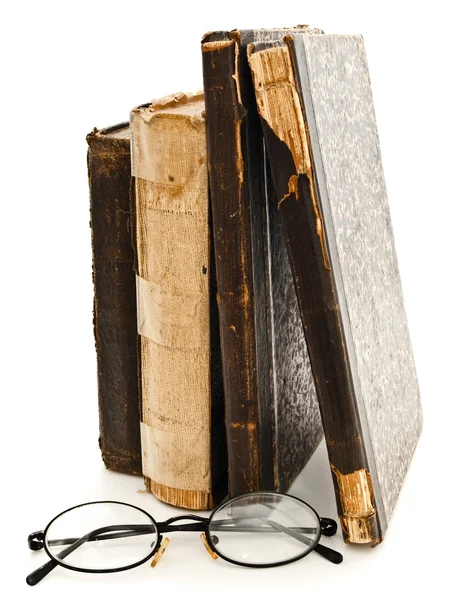 Stare książki i okulary — Zdjęcie stockowe