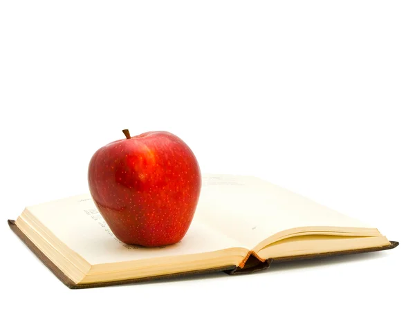 Apfel auf dem Buch — Stockfoto