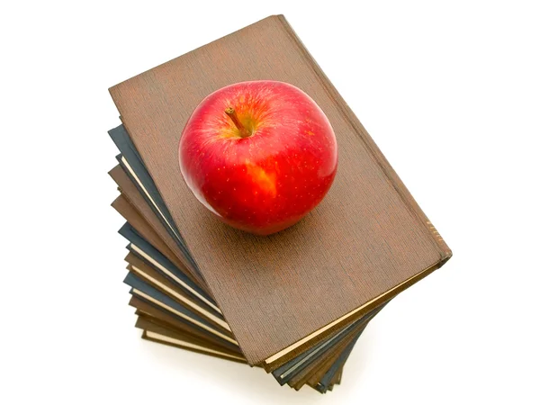 Jabłko w pobliżu książek — Zdjęcie stockowe