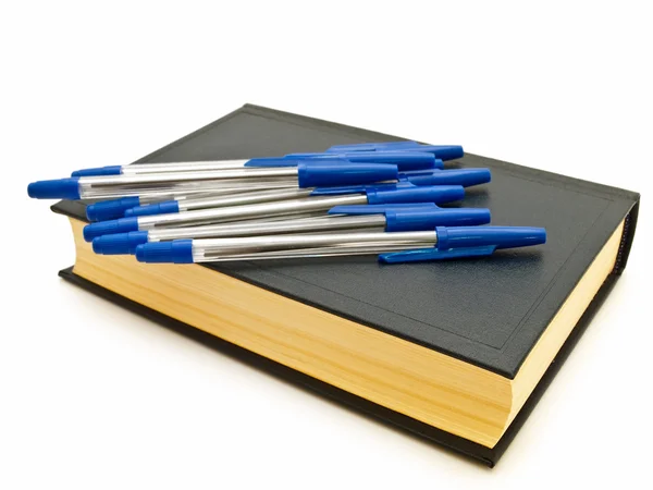 Pens at the book — Stock Photo, Image