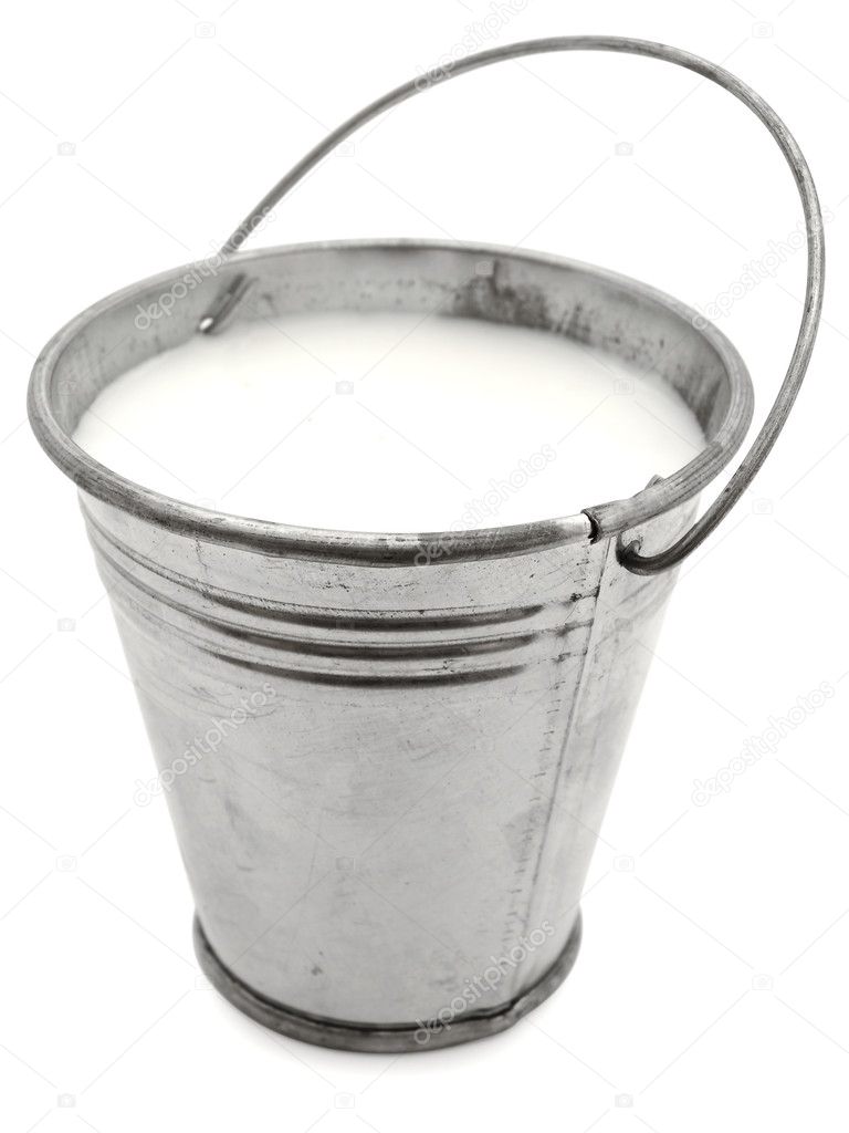 Metal bucket with milk