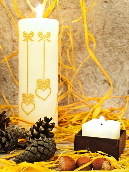 Composition with candles, cones and nuts — Stock Photo, Image