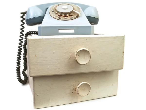 Old phone at drawers — Stock Photo, Image