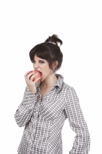 stock image The girl biting a red juicy apple