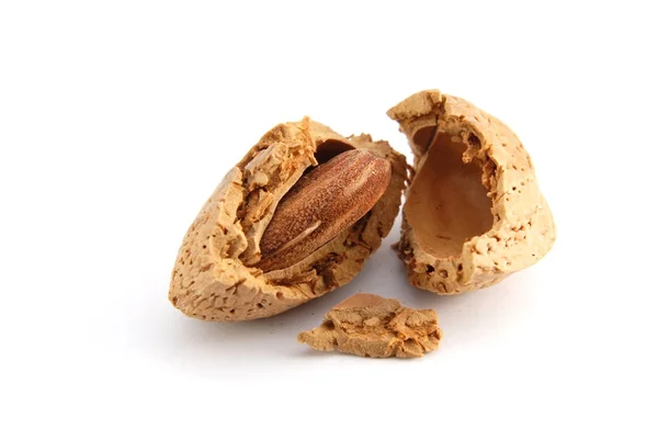 Cracked almond in a shell — Stock Photo, Image