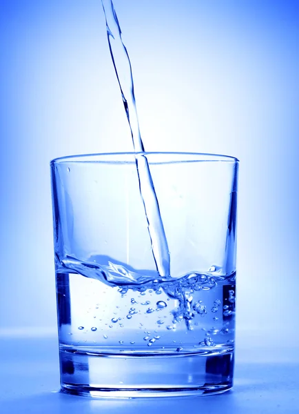 Water splash in a glass — Stock Photo, Image