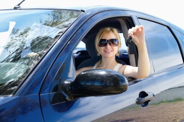 Woman stretches out his hand with the car keys clipart