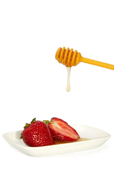 Honing en aardbeien — Stockfoto