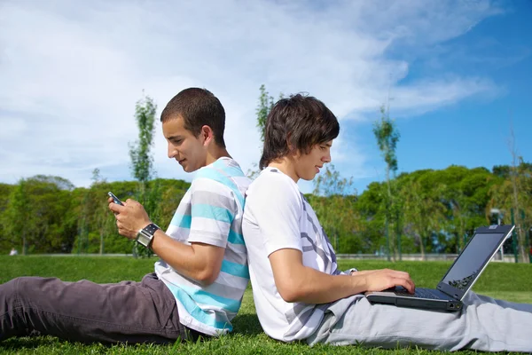 Two guys in a park with — Stock Photo, Image