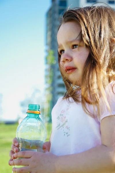 Girl with bottle of water — Stock Photo, Image