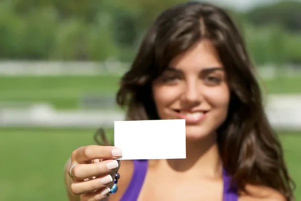 Beautiful girl with business card — Stock Photo, Image