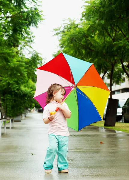 Girl in the park with umbrella — Stock Photo, Image