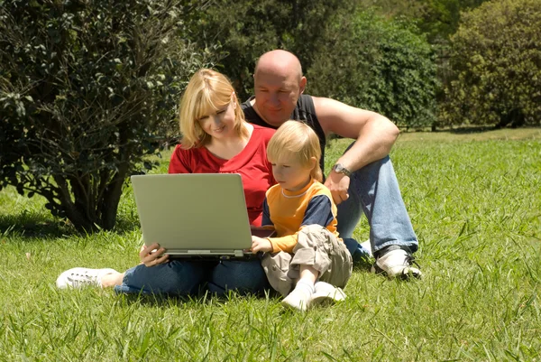 Mother father and son in the park — Stock Photo, Image
