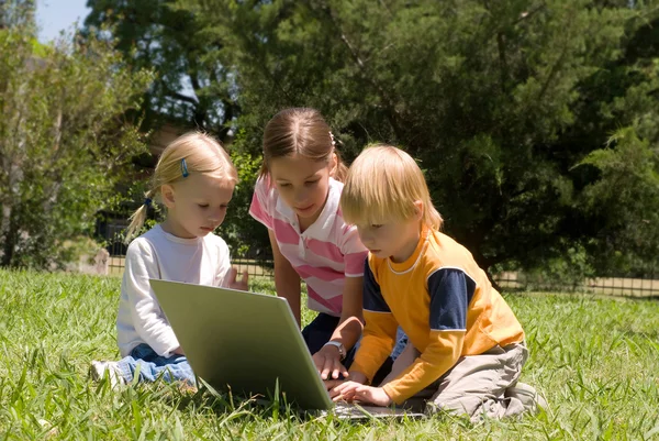 Three Little hackers with laptop — Stock Photo, Image