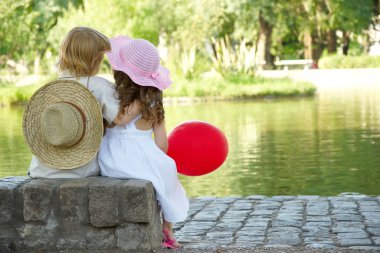 Boy and girl in the park clipart