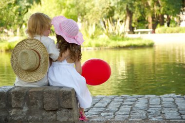 Boy and girl in the park clipart