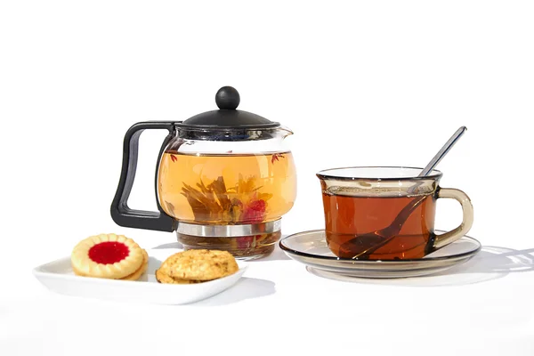 stock image Glass of tea and biscuits