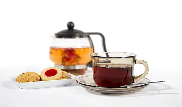 stock image Glass of tea and biscuits