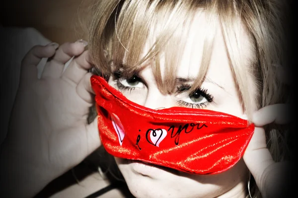 Blonda woman with red mask — Stock Photo, Image