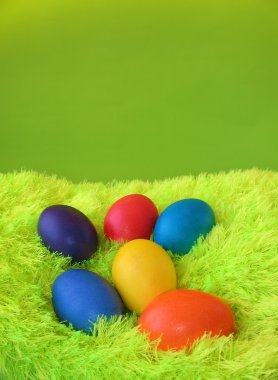 Six easter eggs on green clipart