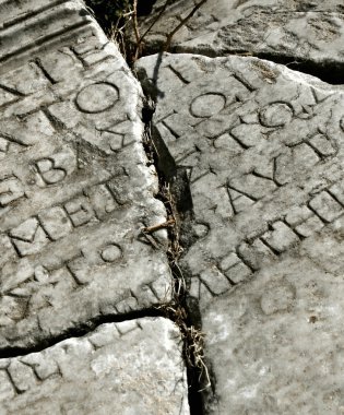 Ancient stone with latin inscription clipart