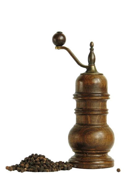 Pepper mill and handful of black pepper — Stock Photo, Image