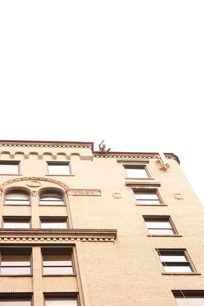 stock image Man walks by a building