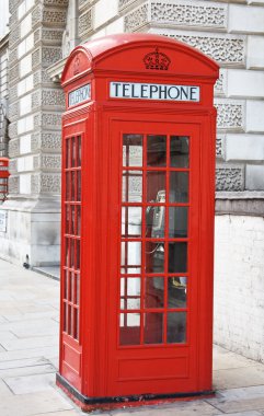 Red telephone booth in London clipart