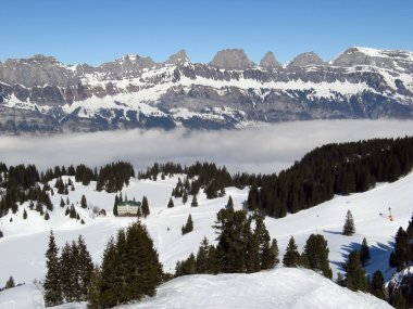 Alpine hotel in ski resort Flumserberg clipart