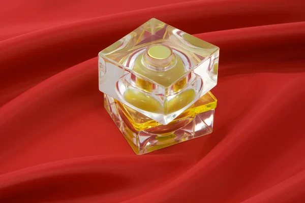 stock image Perfume on red