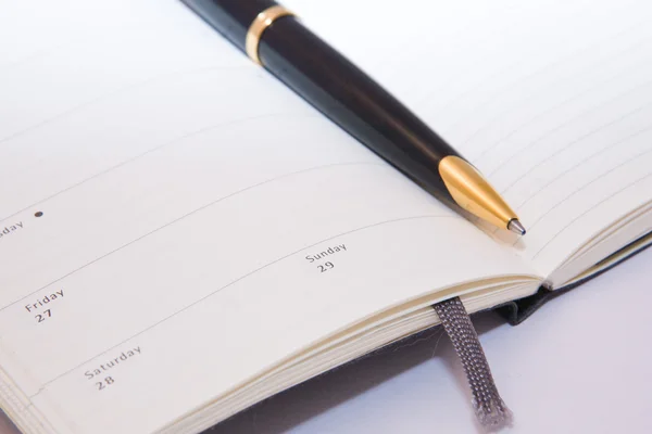 stock image Blank writing-book and pen isolated