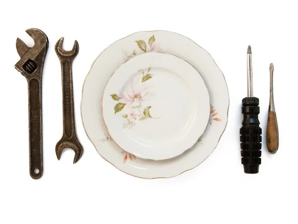 Plates and tools on white — Stock Photo, Image