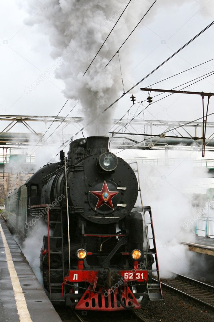 Steam locomotive with smoke and steam