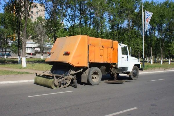 yellow garbage truck