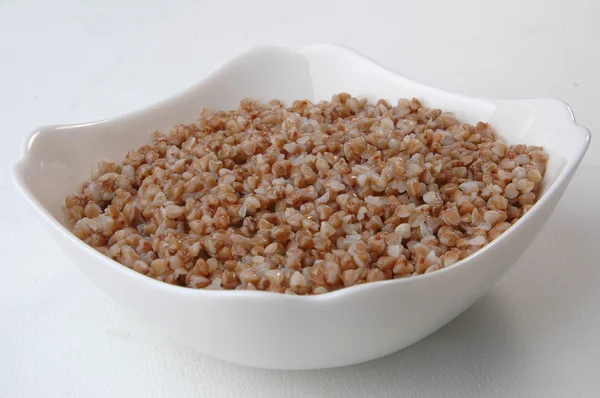 Groats porridge in plate — Stock Photo, Image