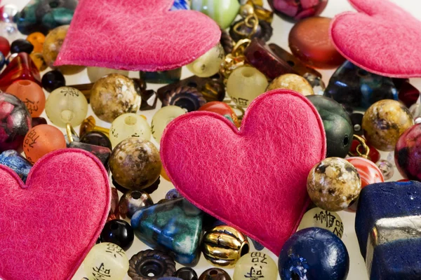 Fancy beads and hearts Royalty Free Stock Images