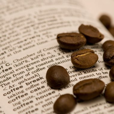 Coffee beans on book clipart